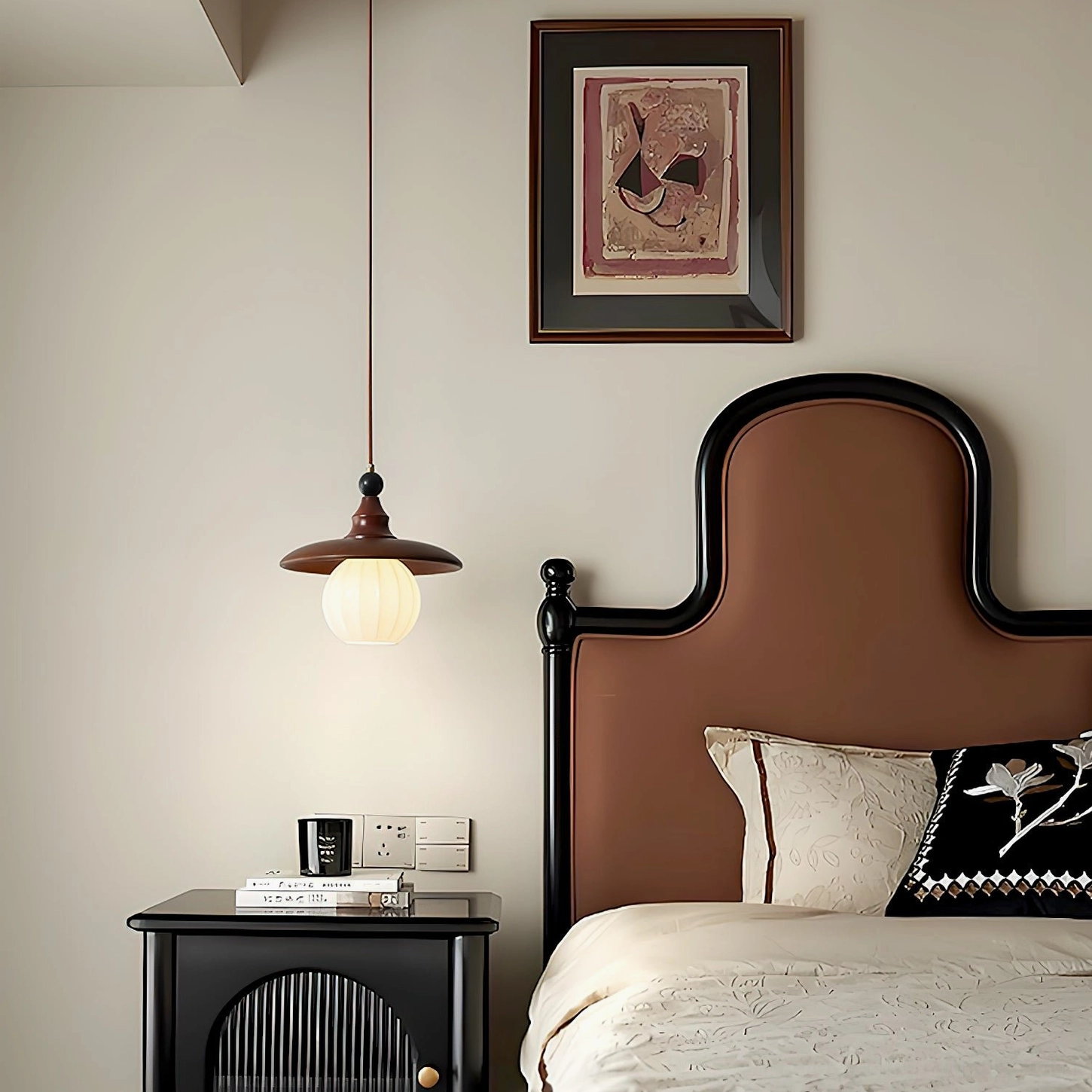 Kato pendant light showing sculptural walnut shade and textured glass diffuser detail