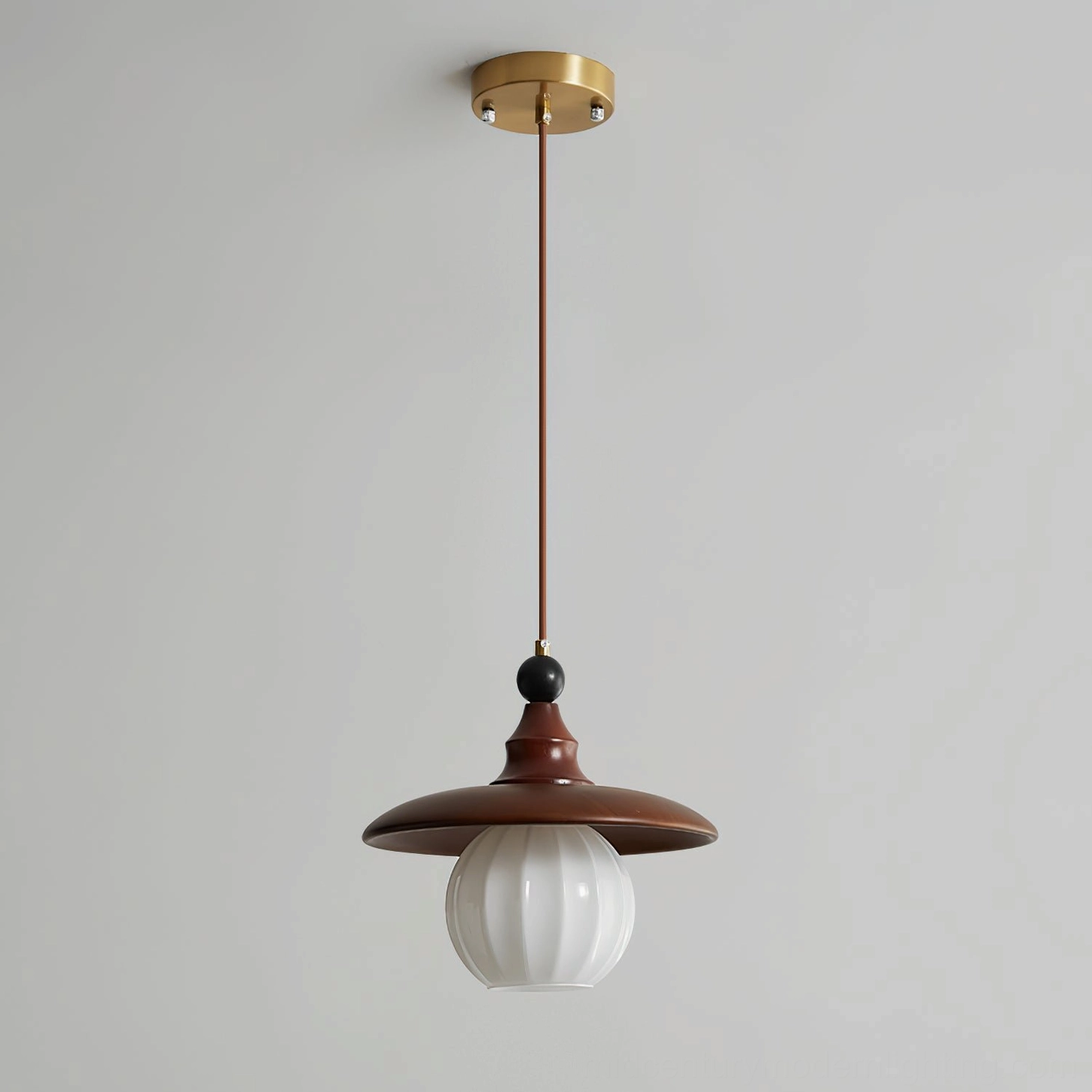 Kato single pendant light showing complete profile with wood and brass accents
