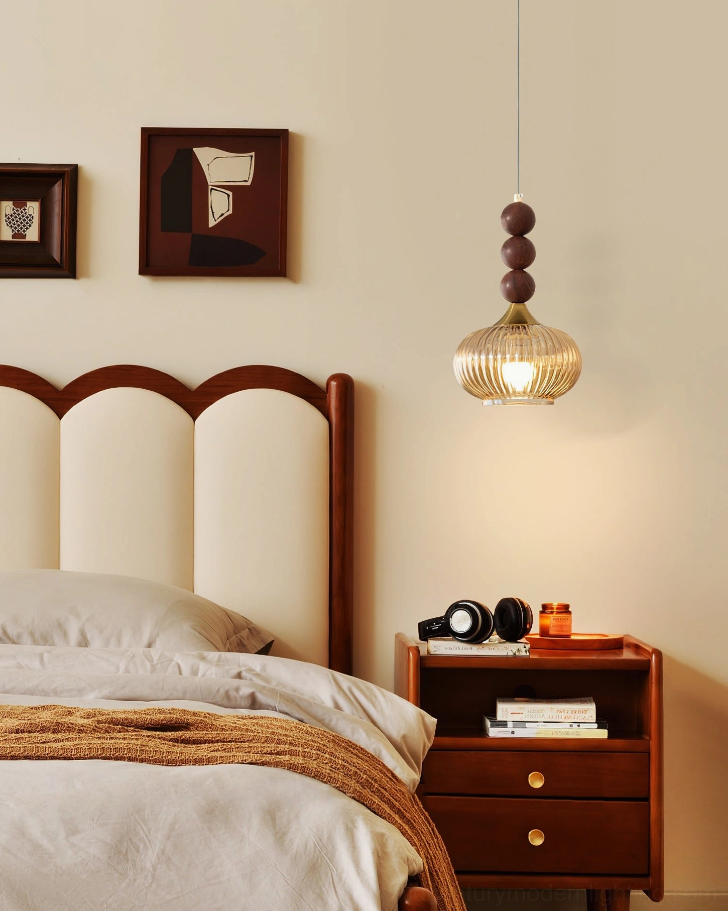 Kaydan ribbed glass pendant light in warm retro bedroom with arched headboard