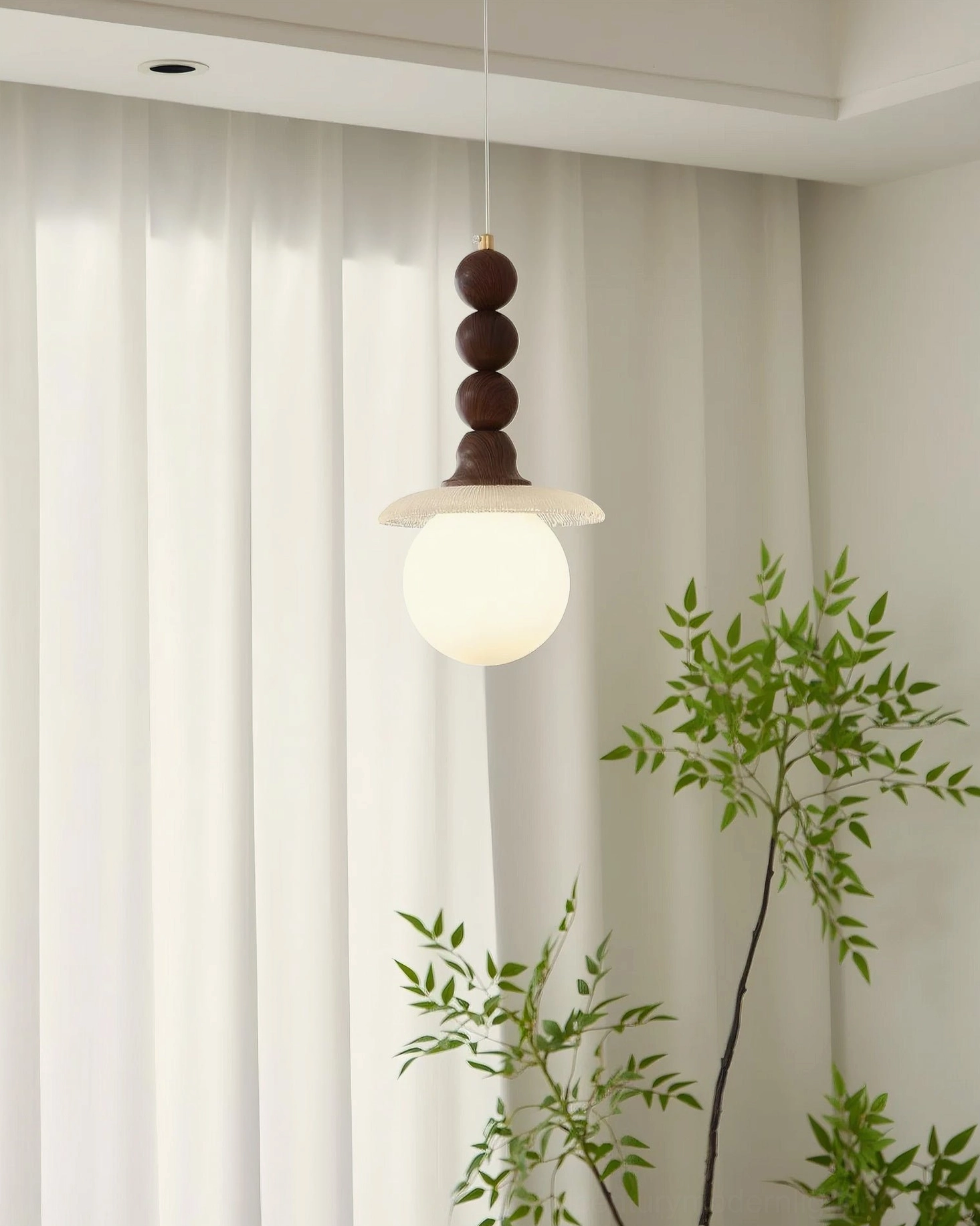 Kaydan mid-century modern pendant light installed in stylized home interior