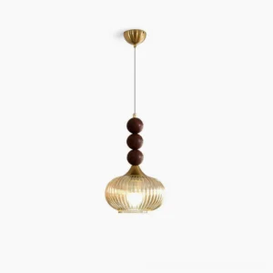 Kaydan mid-century modern pendant light with ribbed amber glass and brass hardware, studio white backdrop