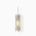 Kean handcrafted faceted glass pendant lamp with polished brass frame and clear ribbed glass shade, studio front view with warm LED illumination