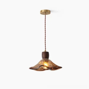 Keju amber glass pendant light with walnut wood connector, front overhead studio view showcasing rippled glass shade and brass ceiling mount