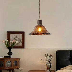 Keju pendant light hanging in vintage bedroom corner with dark wood side table and warm ambient lighting creating intimate atmosphere