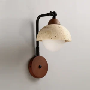 Kell travertine wall light three-quarter angle showing black metal articulated arm, walnut wooden base, and frosted glass diffuser