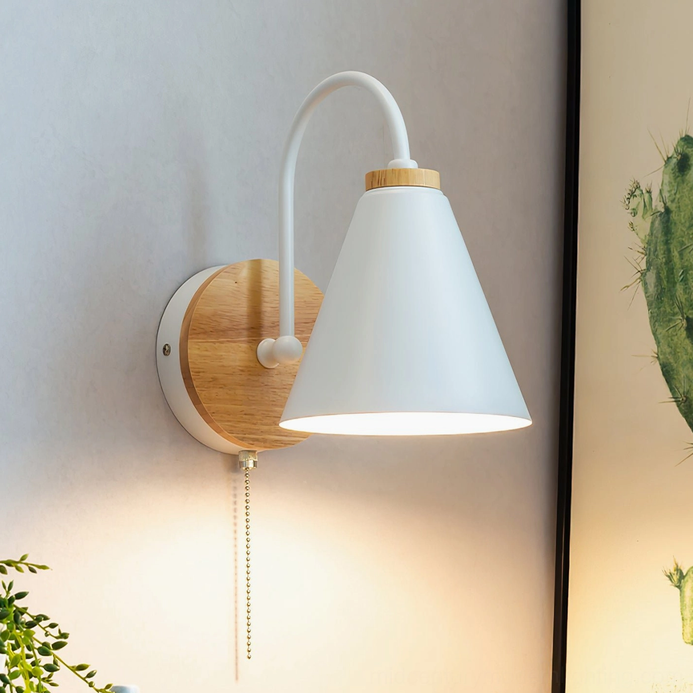 Modern Kenji wall reading lamp mounted on residential wall with warm ambient lighting and pull chain switch detail