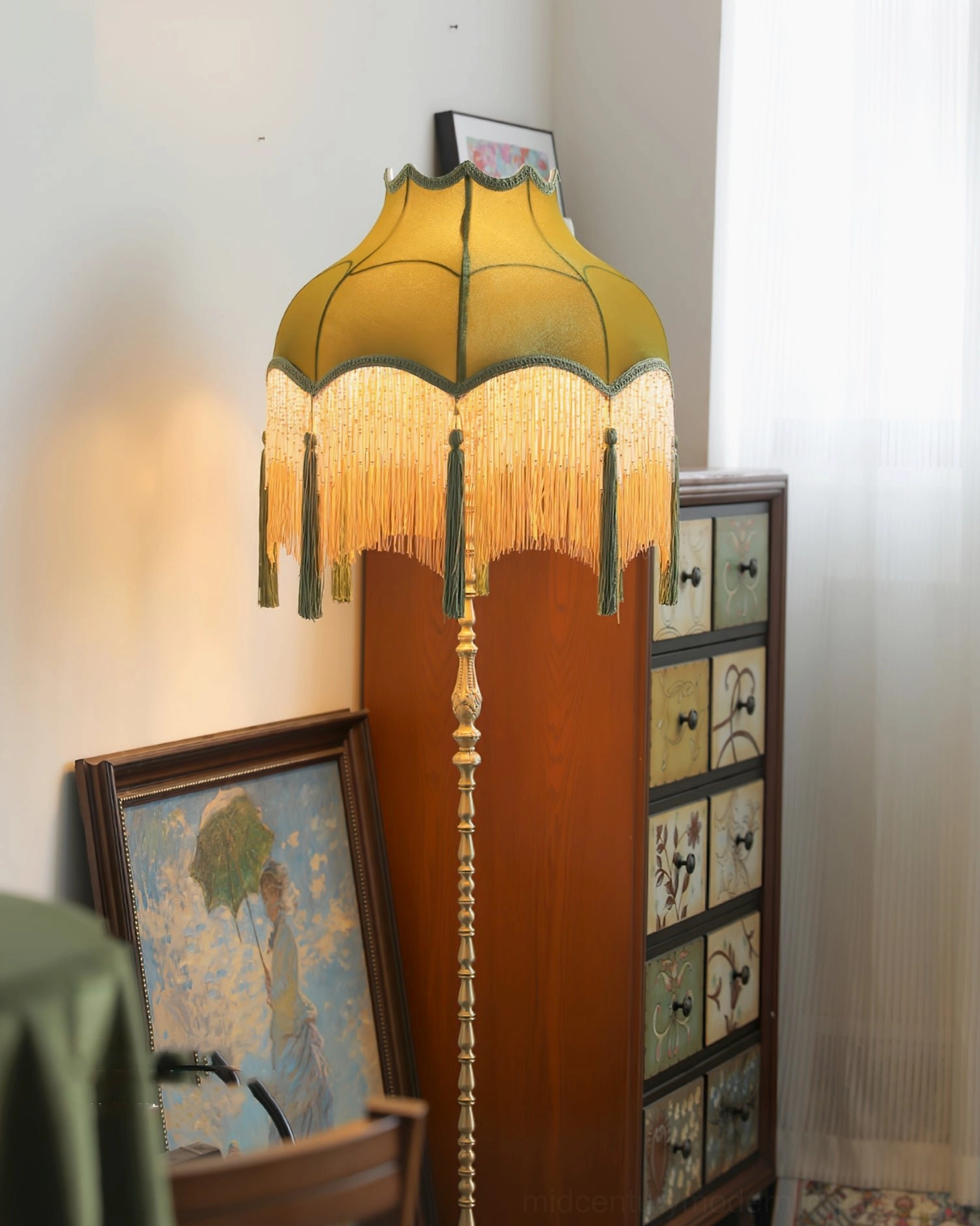 Kennedy emerald green tassel floor lamp warm retro aesthetic indoor corner with art and wooden cabinet