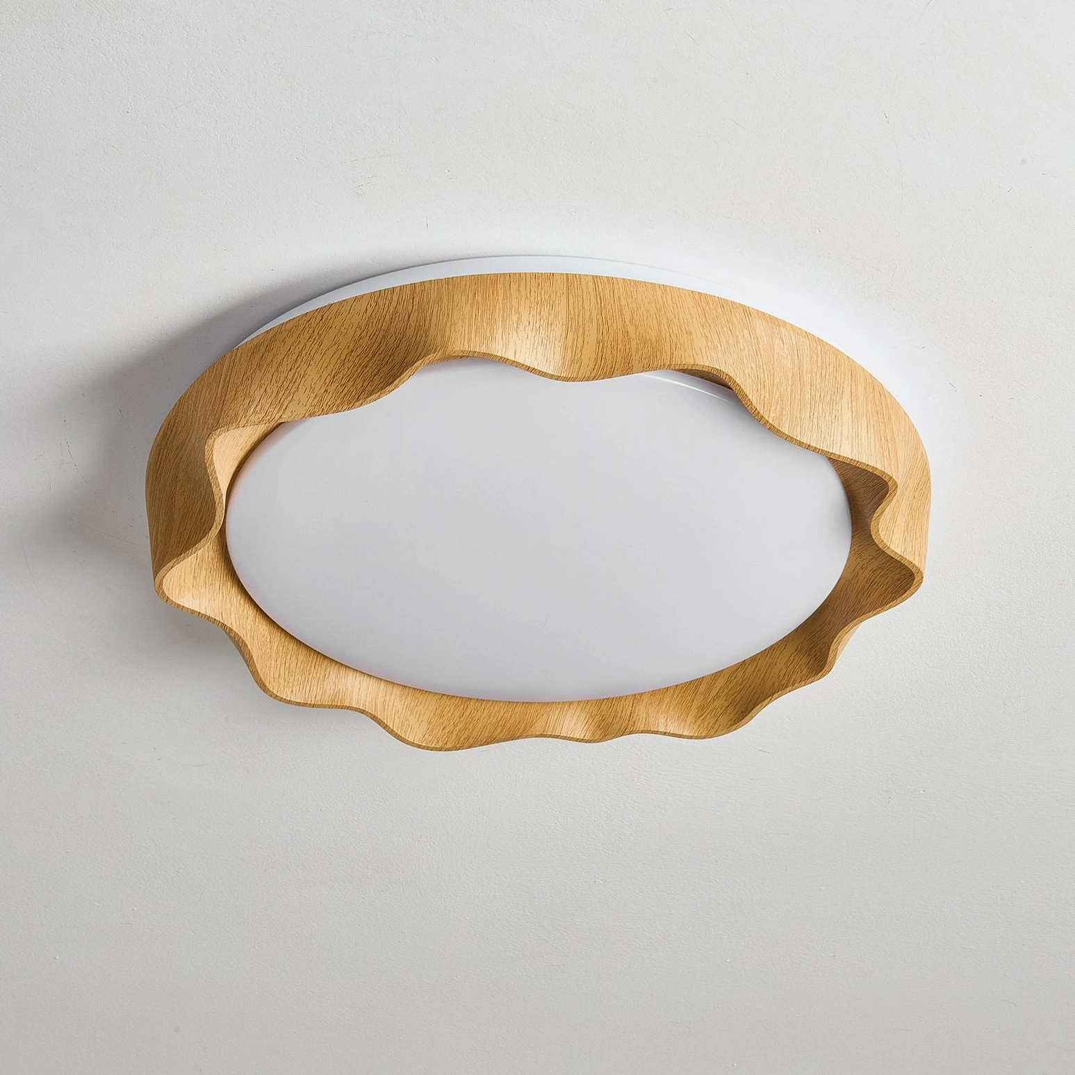 Kerio scalloped wood frame ceiling light close-up showing smooth frosted acrylic diffuser panel