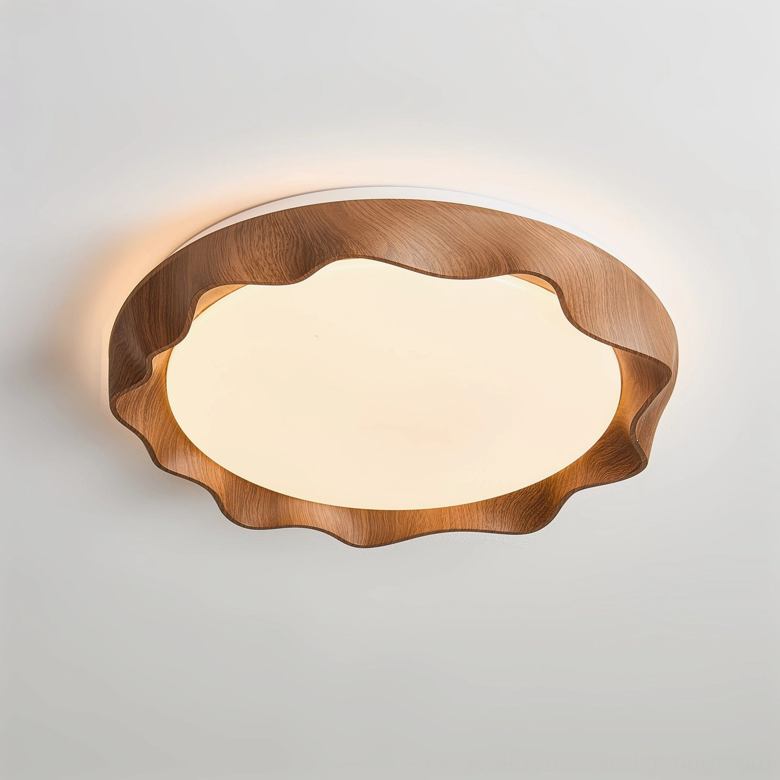 Kerio walnut finish ceiling light with wavy frame, illuminated showing warm ambient light distribution