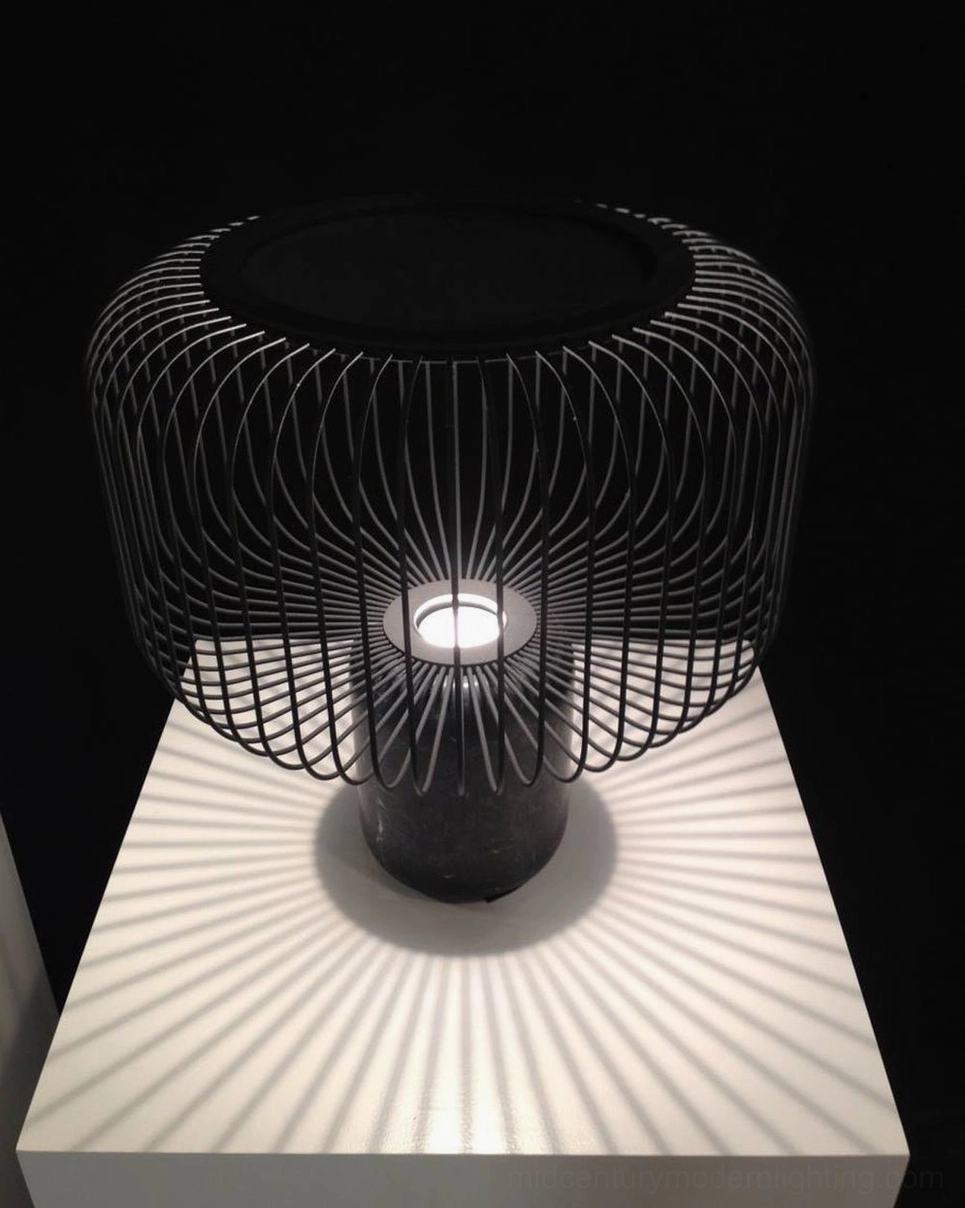 Keshi marble lamp with integrated LED illuminated in modern bedroom nightstand setting