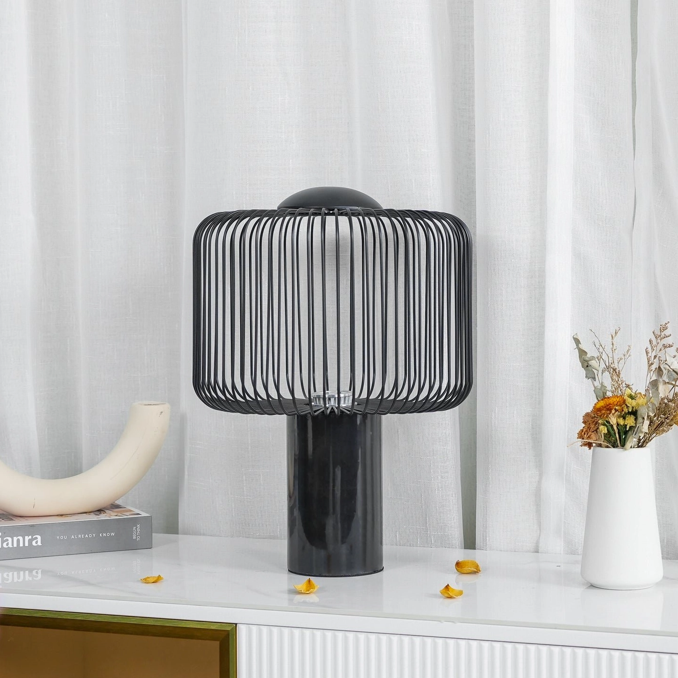 Keshi table lamp three-quarter view on luxury living room console with dried flowers and decorative accessories