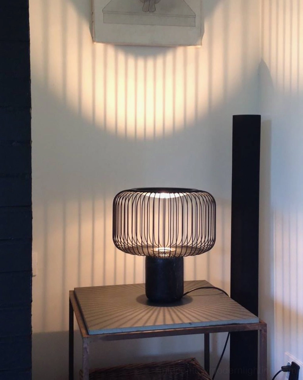 Keshi black marble table lamp detailed view of mirror-finish reflector and geometric cage design