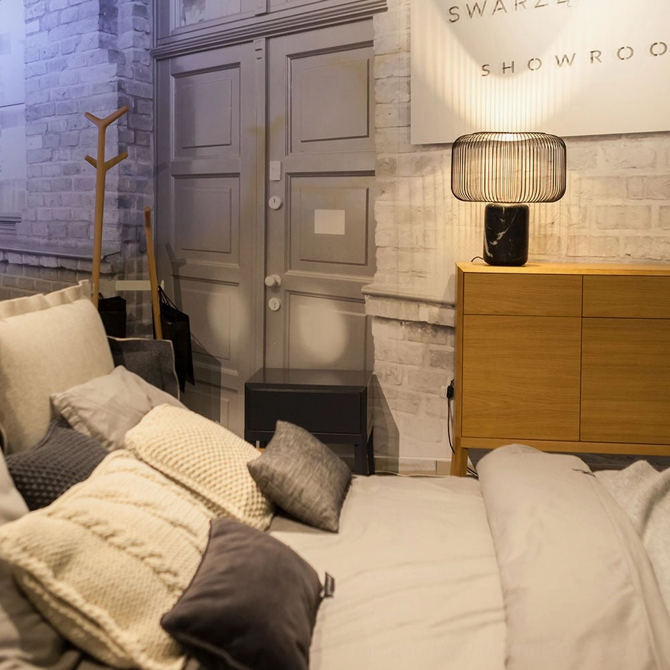 Keshi table lamp side profile showing geometric cage shade and cylindrical marble base proportion