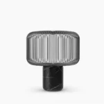 Keshi black marble table lamp with matte black metal cage shade front view on white studio background