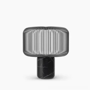 Keshi black marble table lamp with matte black metal cage shade front view on white studio background