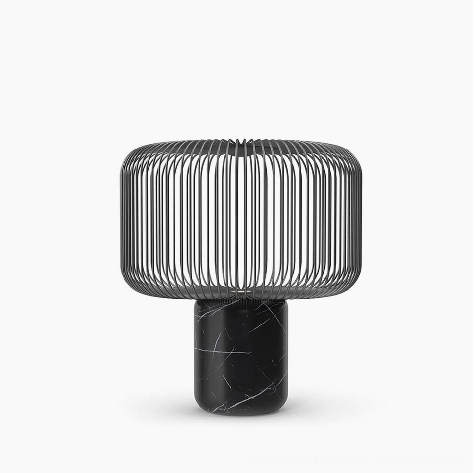 Keshi black marble table lamp with matte black metal cage shade front view on white studio background