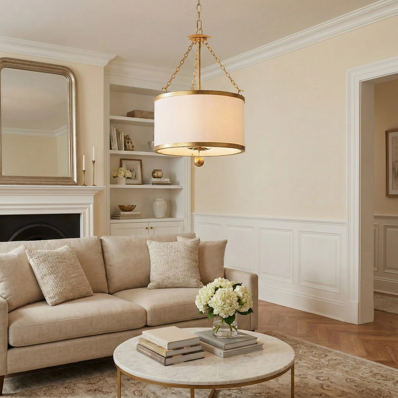 Kian pendant light with brass hardware in traditional living room with fireplace and classic furnishings