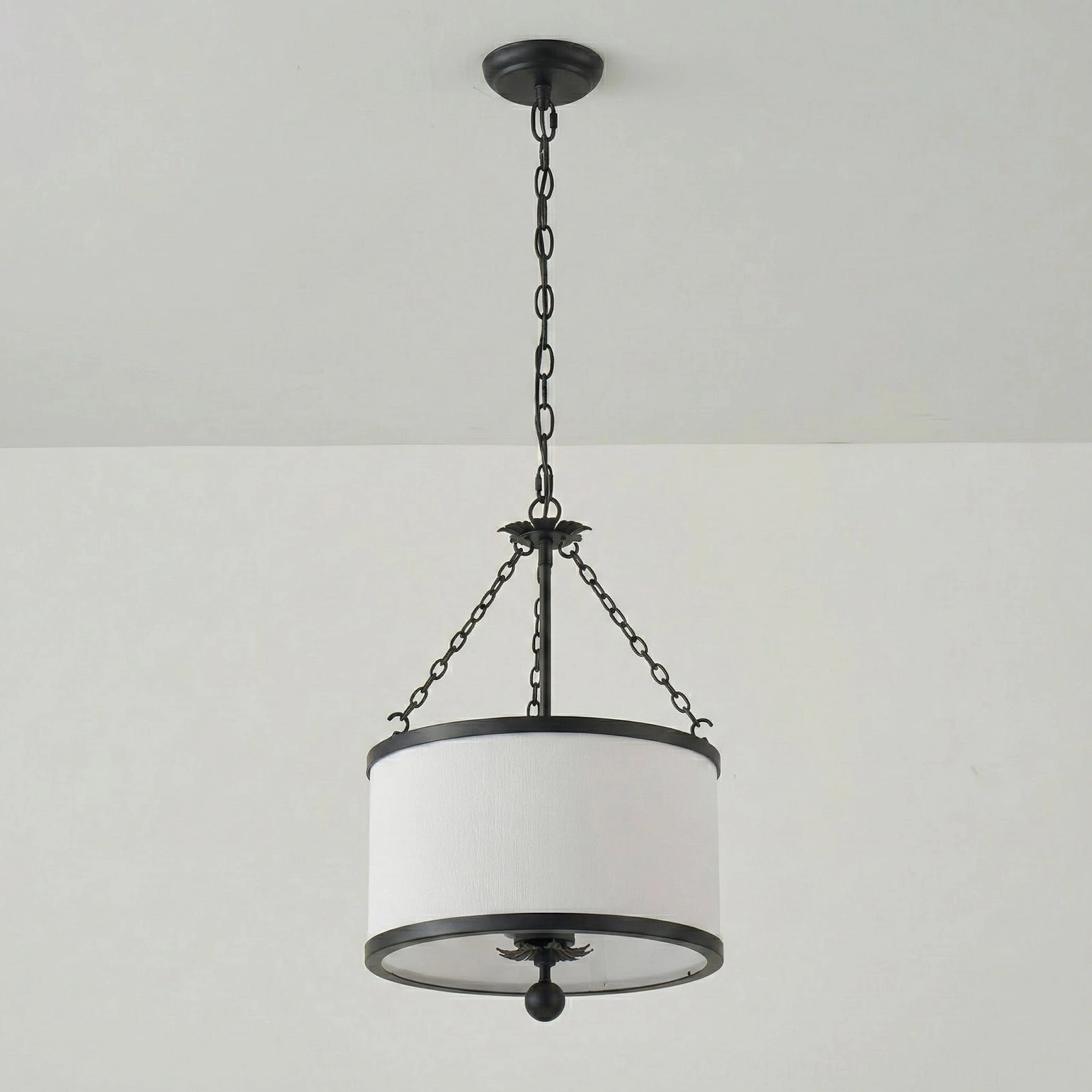 Kian pendant light with black metal frame and white fabric shade, modern finish studio view