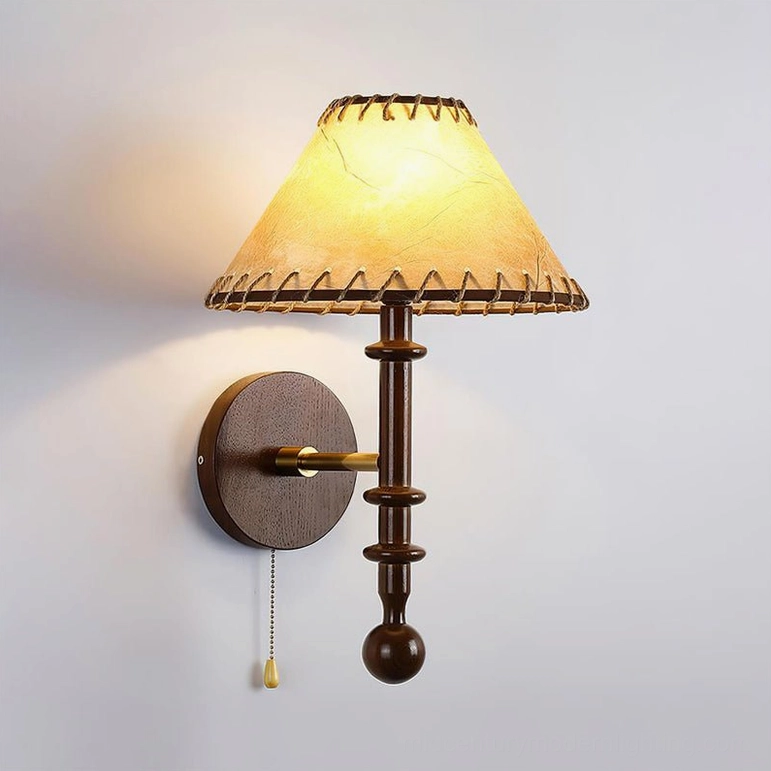 Walnut color Kibo wood wall lamp showing natural wood grain texture and metal mounting hardware, three-quarter view