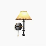Kibo mid-century modern wood wall sconce with handcrafted fabric shade and decorative edge stitching, frontal view on white background