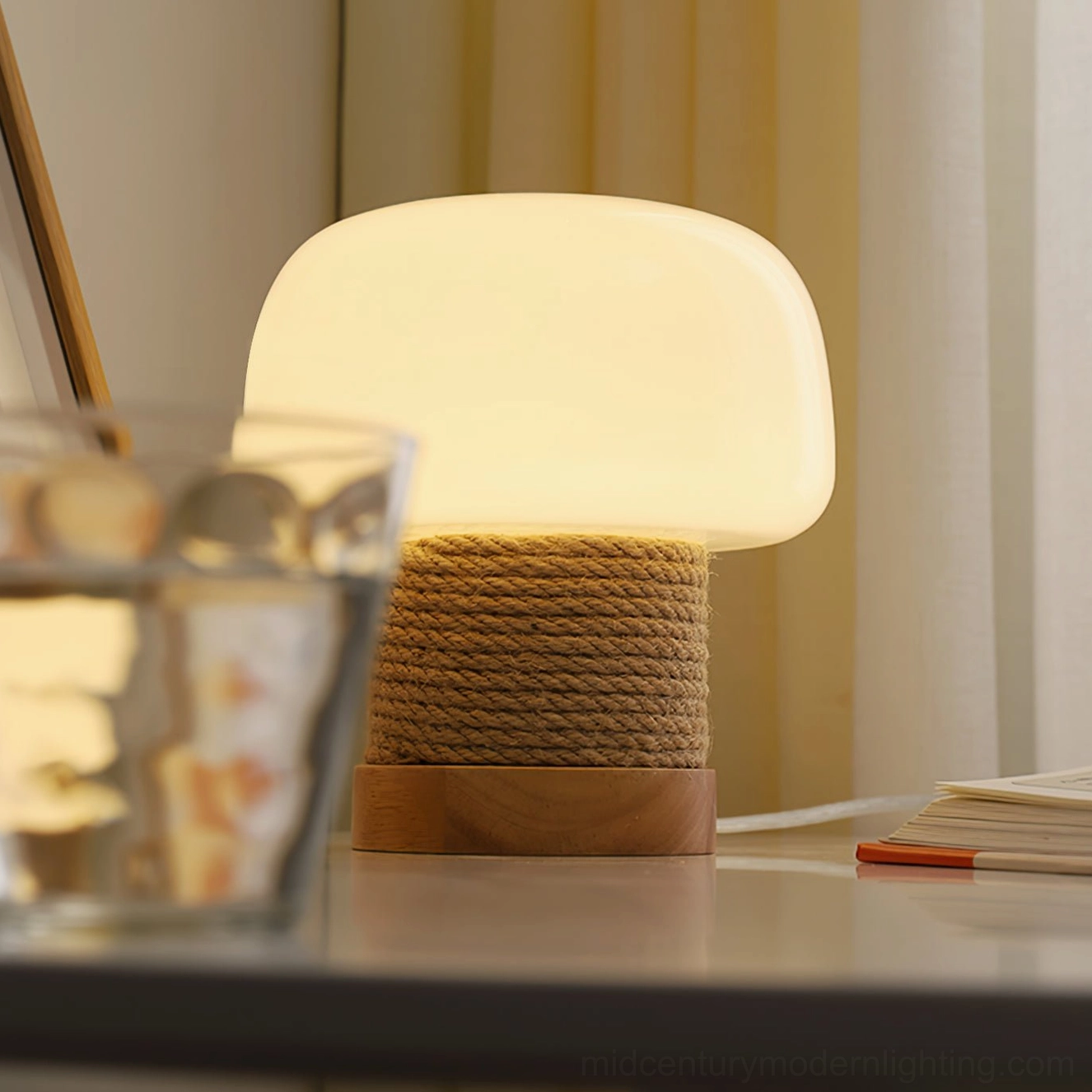 Kimjit table lamp in natural wood finish creating warm bedroom ambiance