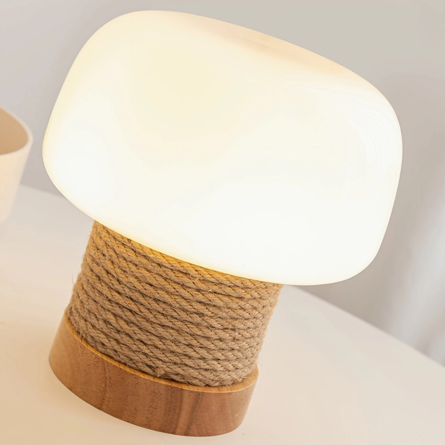Close-up of illuminated Kimjit mushroom lamp showing warm frosted glass diffuser