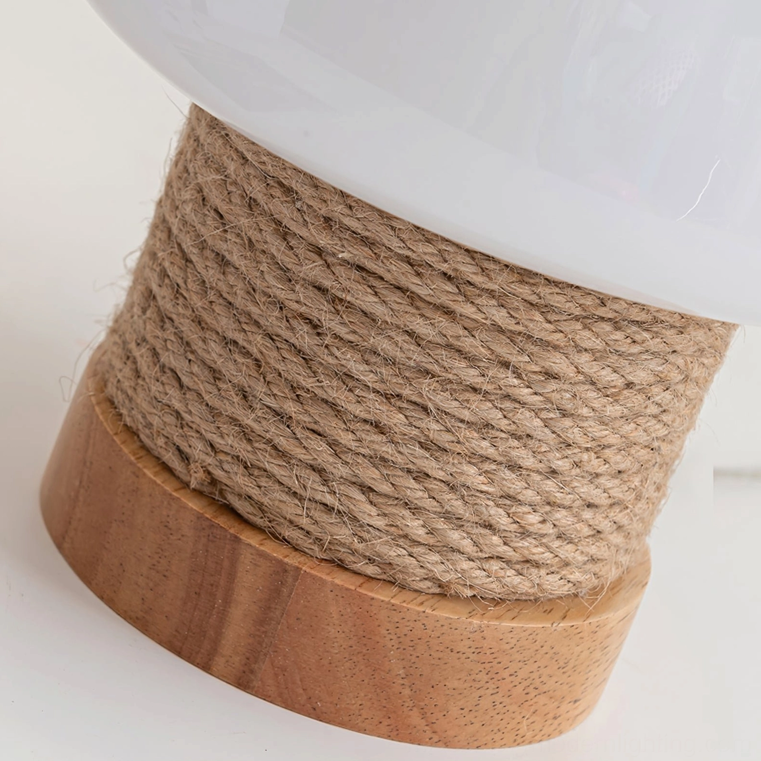 Detailed view of Kimjit lamp base showing natural wood grain and jute rope wrapping