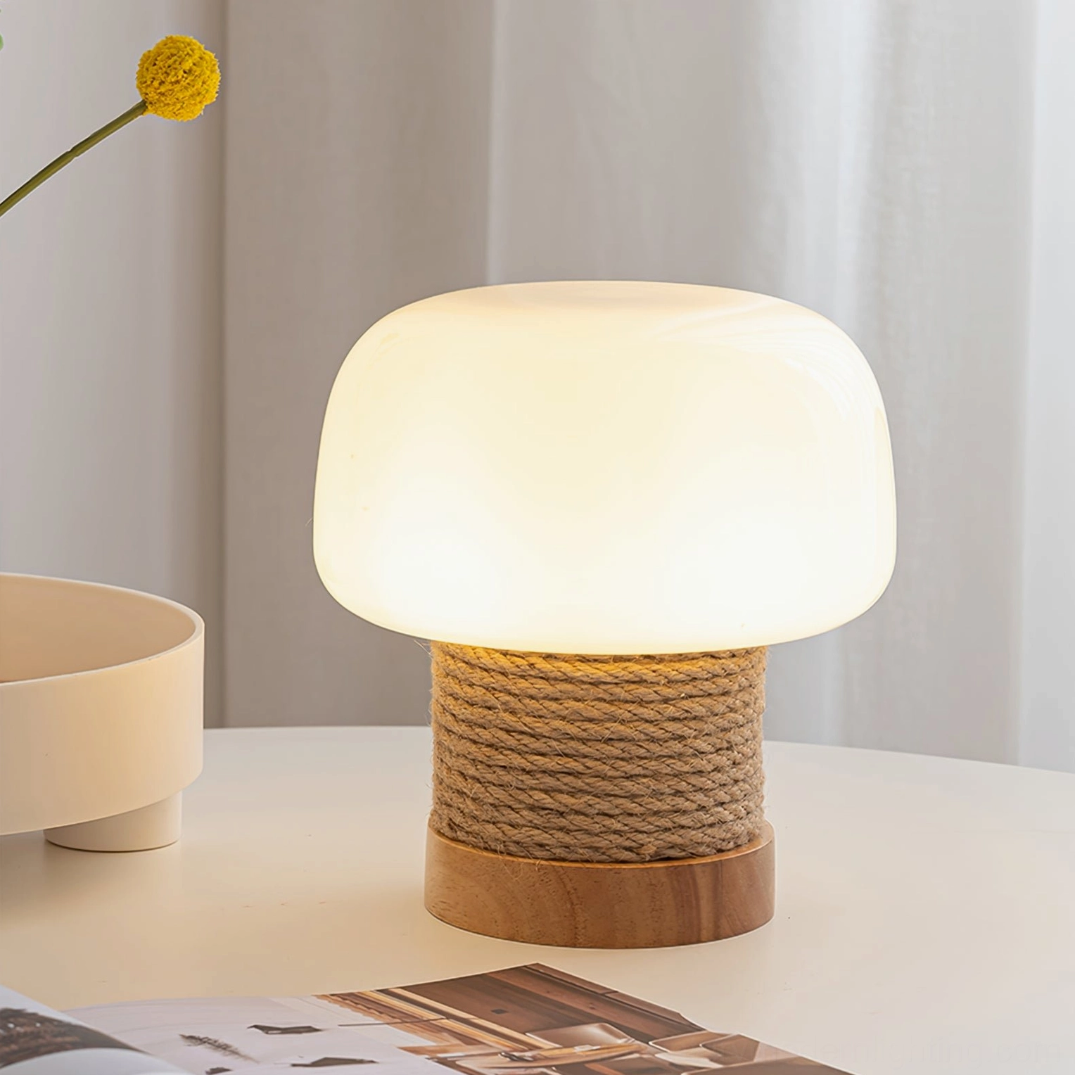 Illuminated Kimjit mushroom lamp creating warm ambient light on home side table
