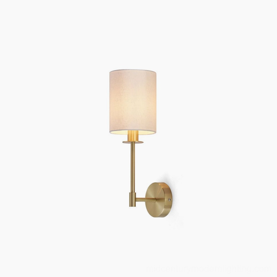 Kington brass wall sconce with cylindrical linen fabric shade, frontal studio view on white background