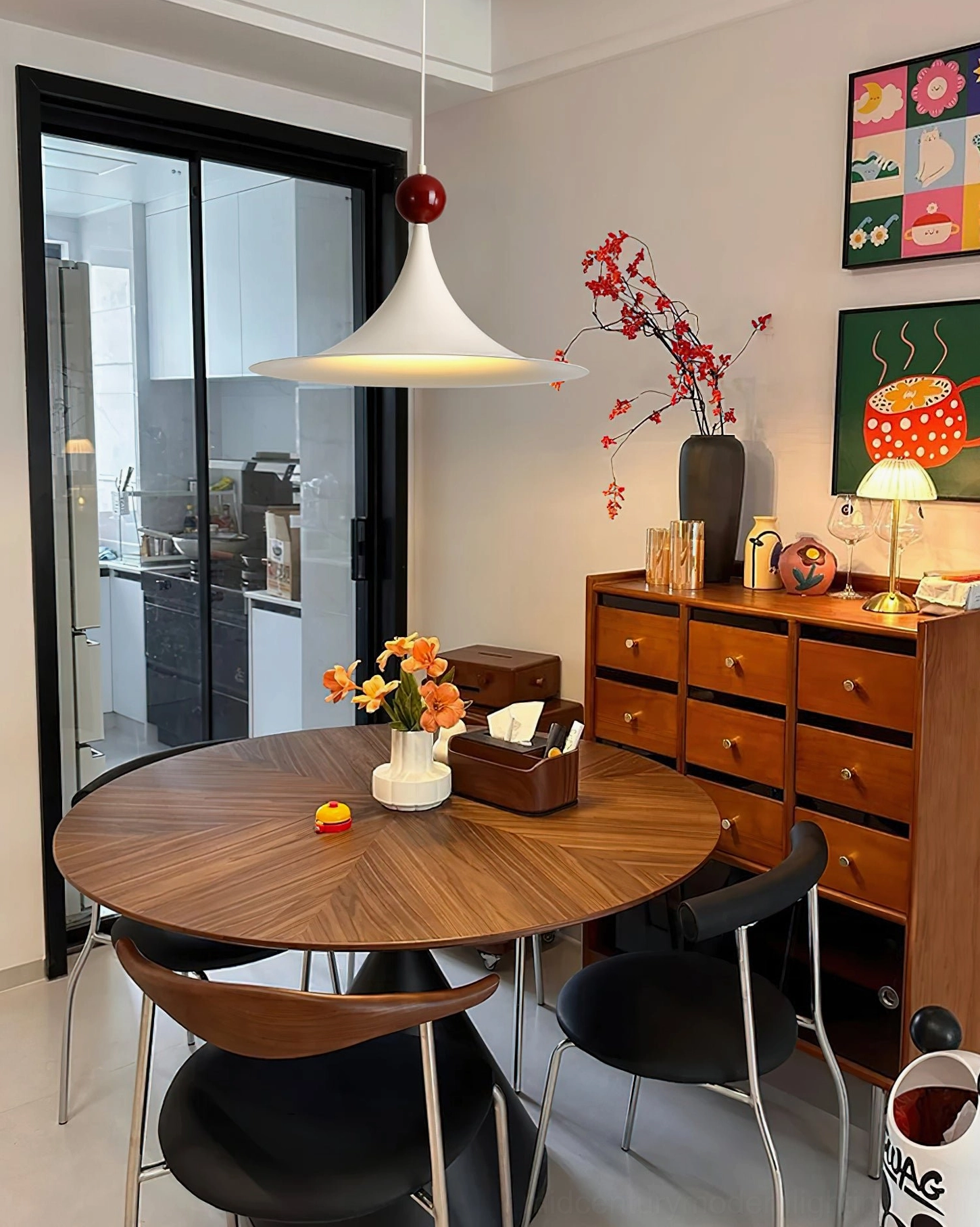 Kinvara modern ceiling pendant in mid-century decorated dining room with wall artwork and vintage decor