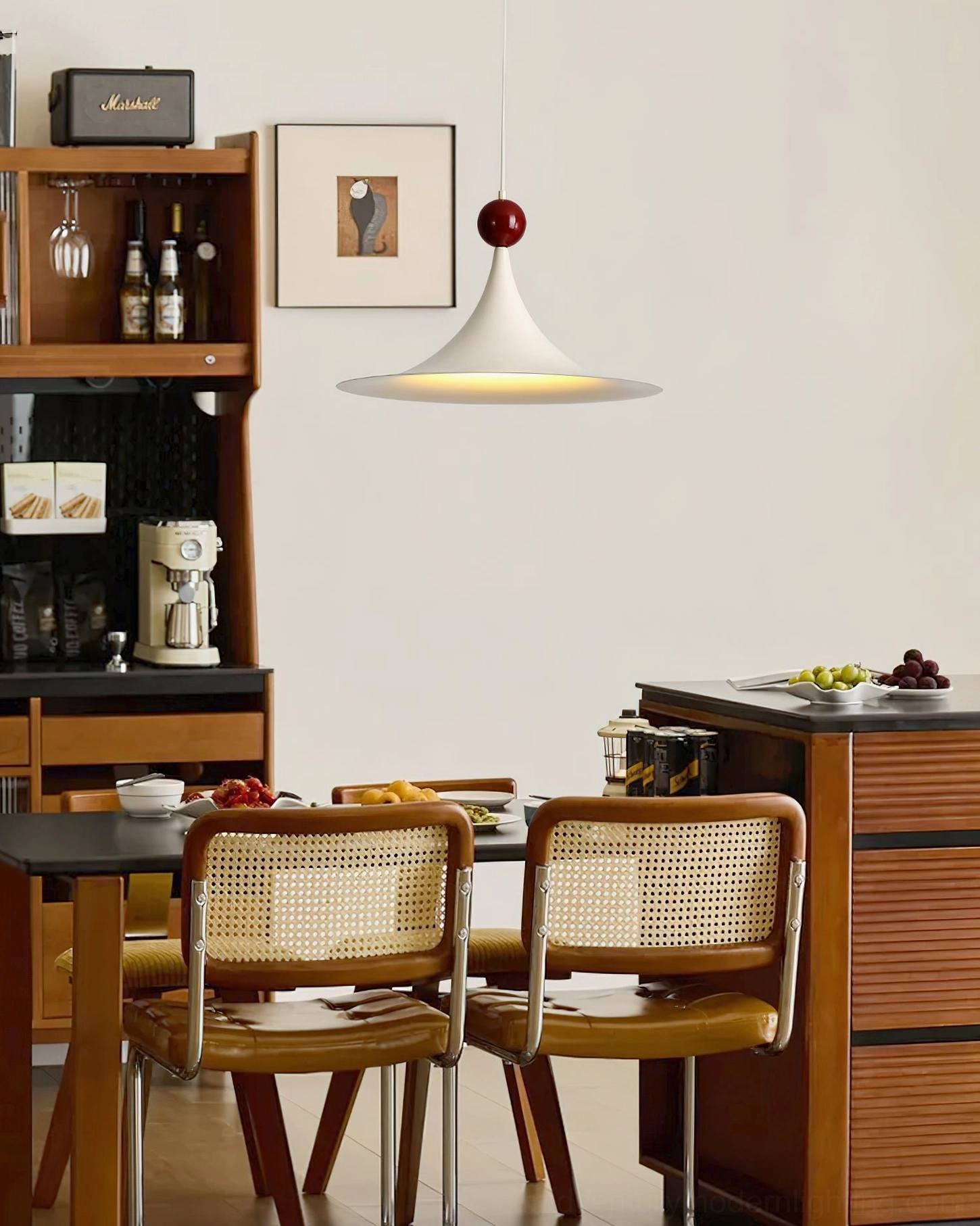 Kinvara pendant light in open kitchen-dining hybrid space creating warm ambient lighting