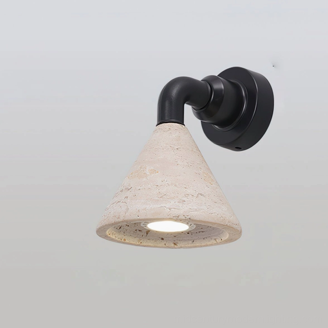 Kiran travertine wall sconce Model A with natural stone cone shade and walnut metal frame detail