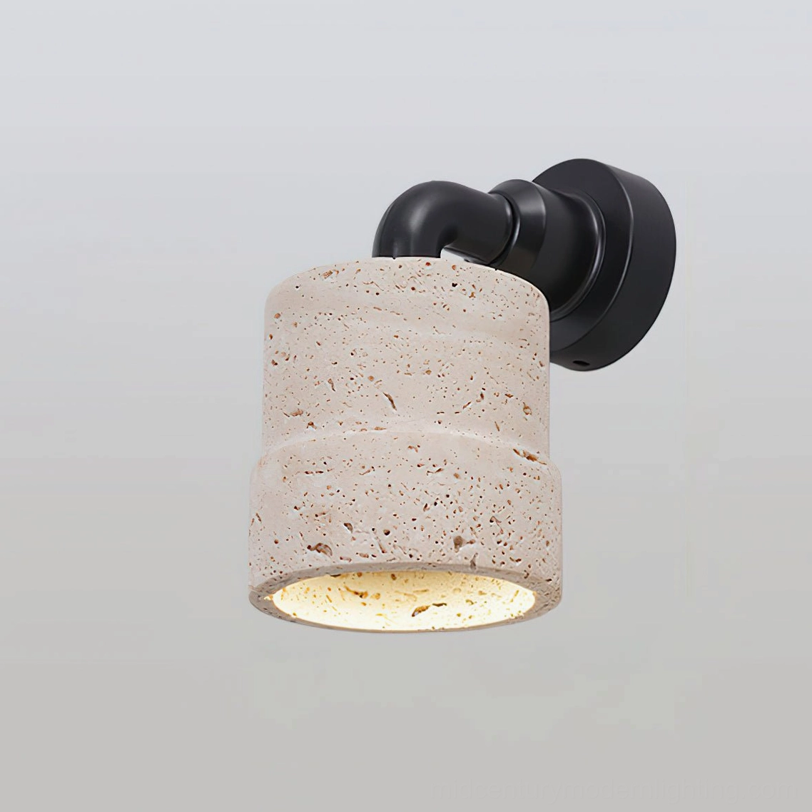Kiran travertine wall sconce Model D with refined metal bracket and natural stone shade