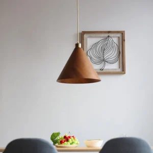 Kiven wooden pendant lamp hanging in Nordic minimalist dining room with warm brass lighting