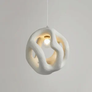 Off-white Kivi pendant lamp illuminated with warm glow, interior eye-level view