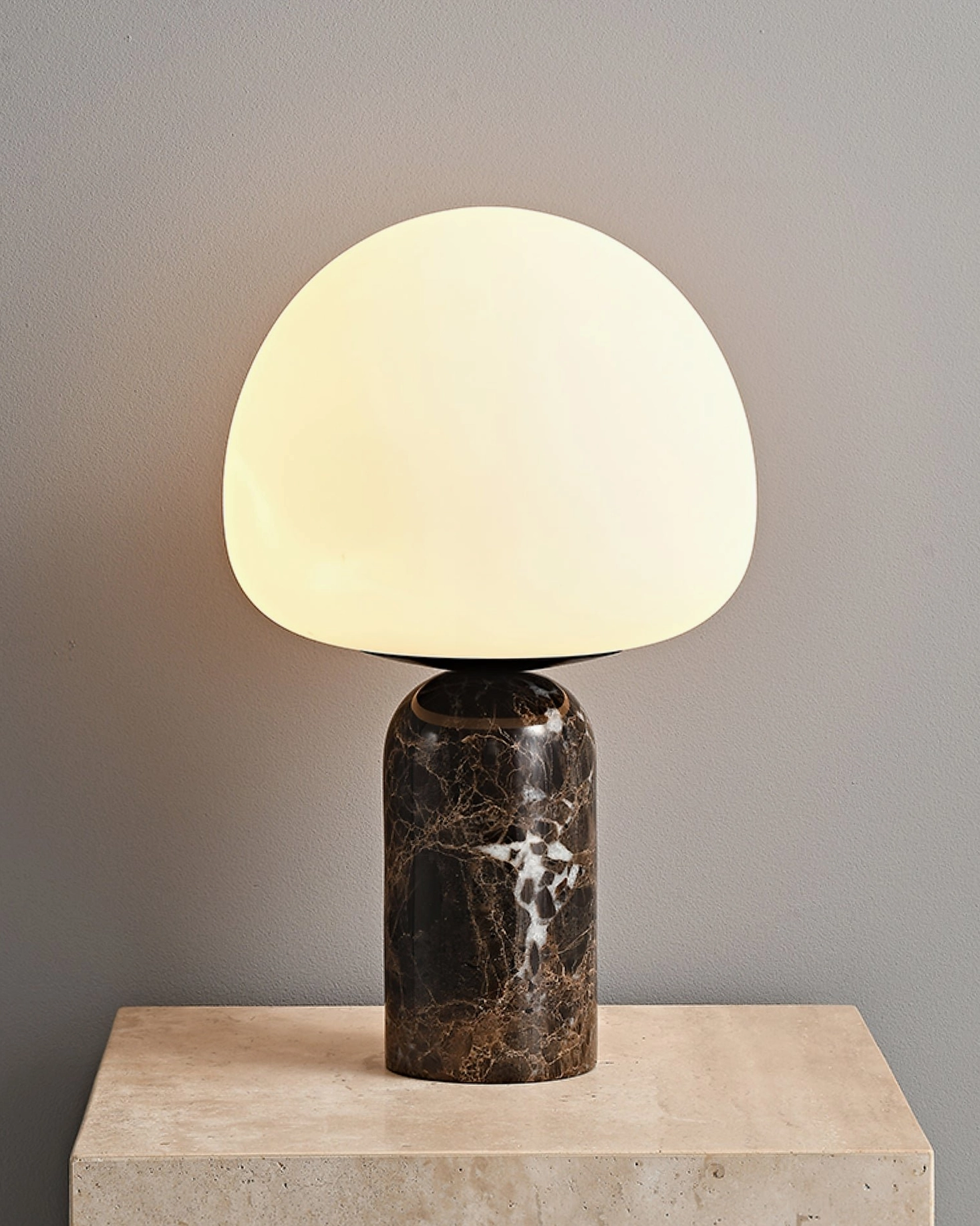 Kizu table lamp functional detail showing E26 socket and glass shade design