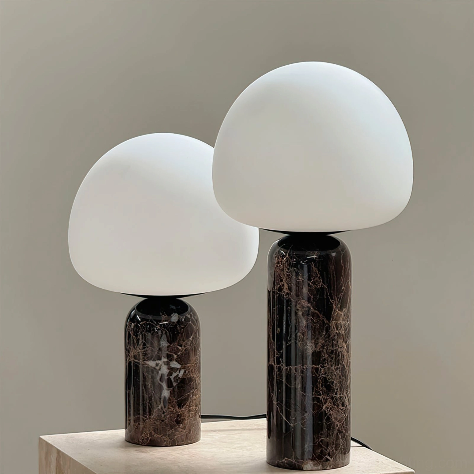Pair of unlit Kizu marble lamps with white shades showing different marble base heights and veining