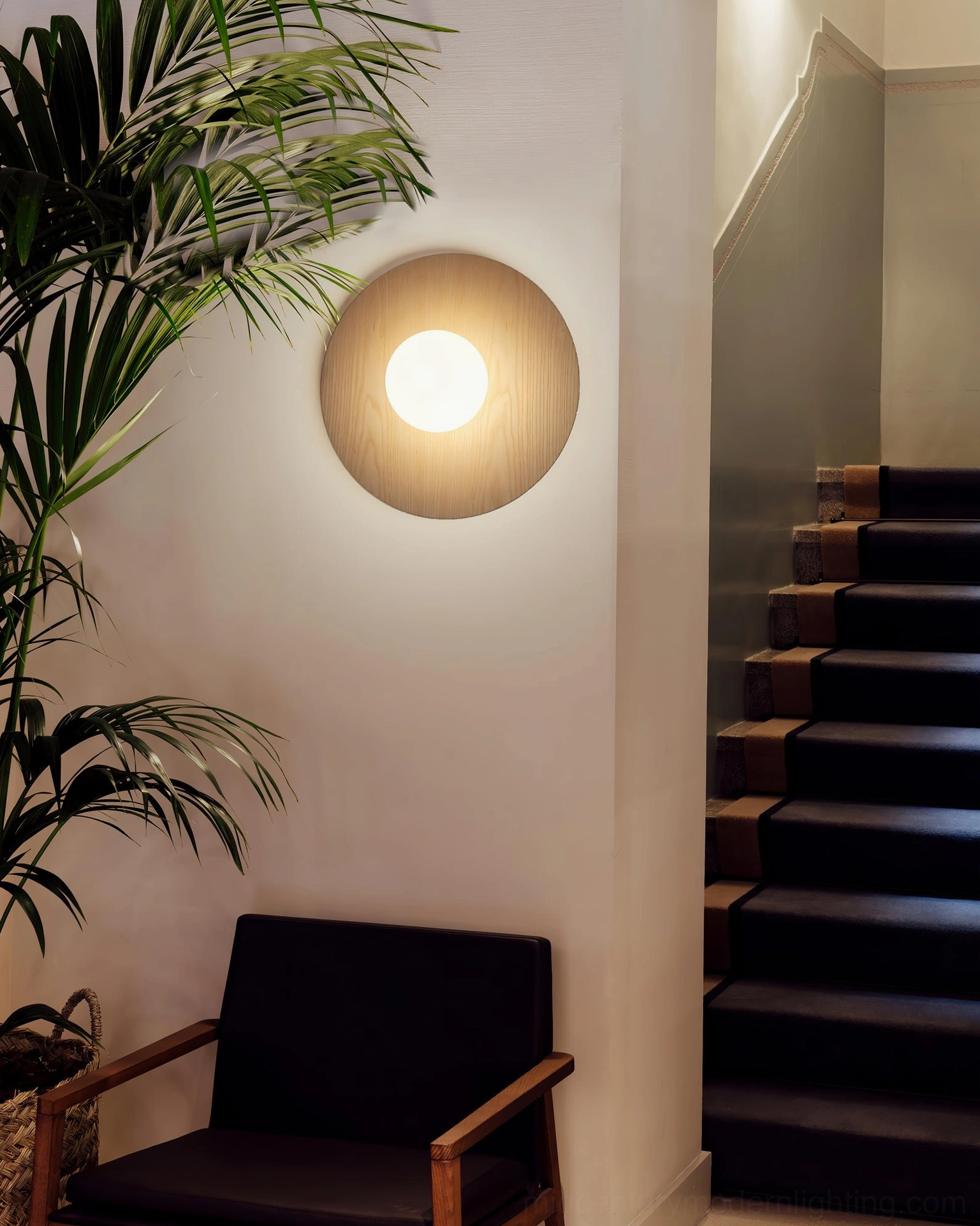 Knock black wall sconce in modern minimalist room, scandinavian design aesthetic sophisticated lighting