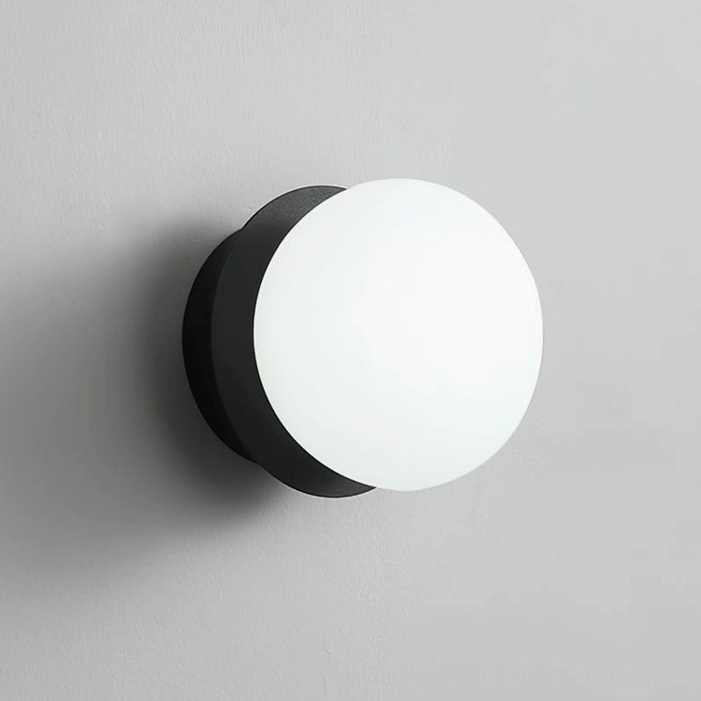 Knock wall lamp Model A black finish, compact round sconce small space efficient minimal lighting
