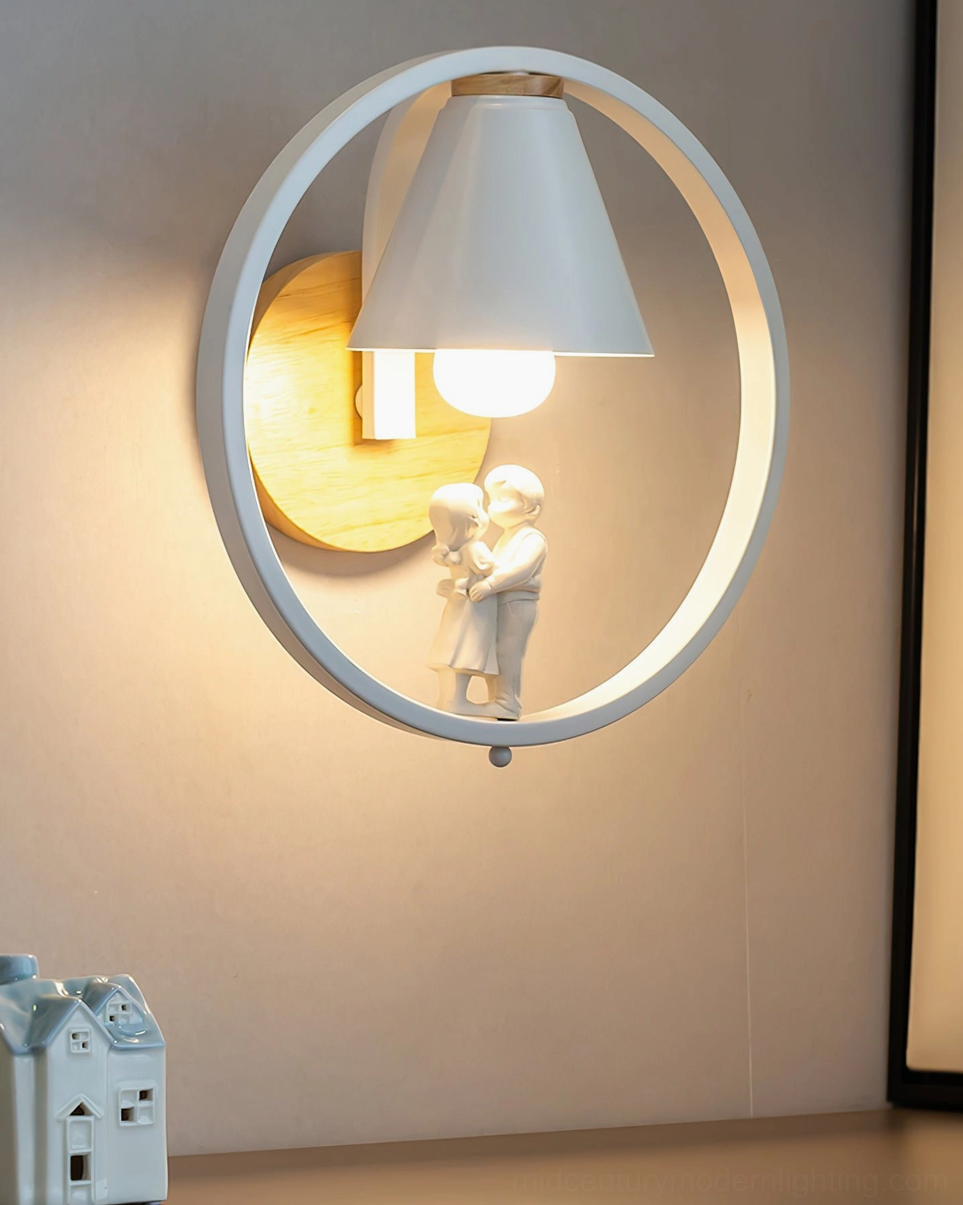 Kona couple-themed wall sconce with kissing figurine accent, mounted display with small decorative house, Nordic minimalist style