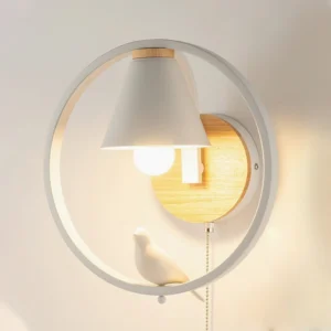 Close-up front view of Kona Nordic wall lamp with pull-chain zipper switch detail, white metal circular frame with wooden base elements