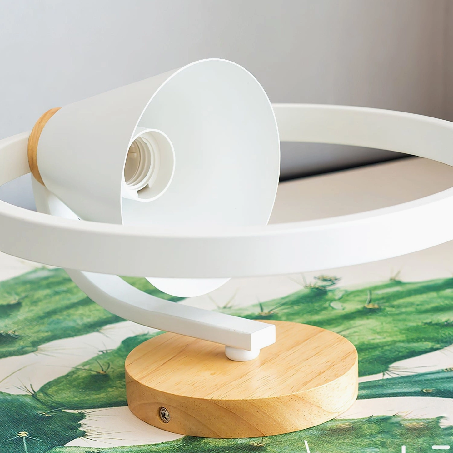 Kona wall lamp hardware and internal components side view showing exposed socket, wood base structure, and metal ring assembly
