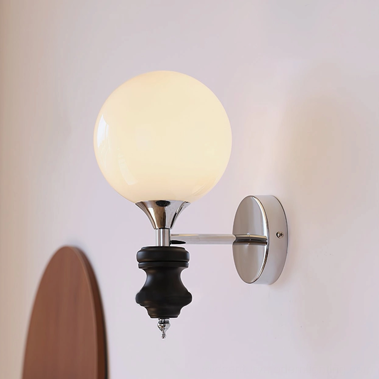 Koscina modern wall lamp - sculptural ceramic base with polished chrome accents studio product photography