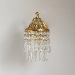 Kristall vintage wall lamp direct front view showing embossed brass top and suspended crystal tassel decorations