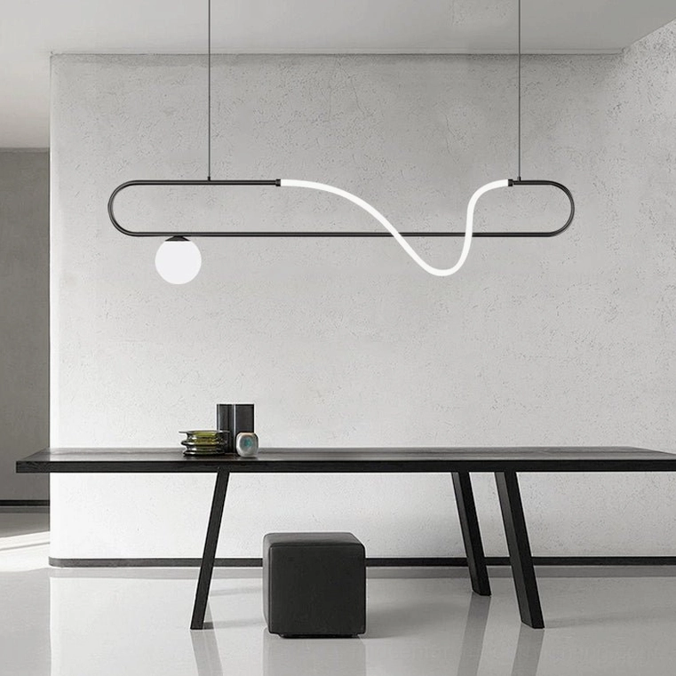 Matte black Kulgony linear pendant light in modern minimalist office workspace