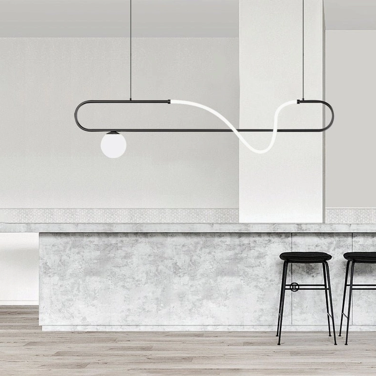 Compact matte black Kulgony linear pendant over kitchen bar counter area