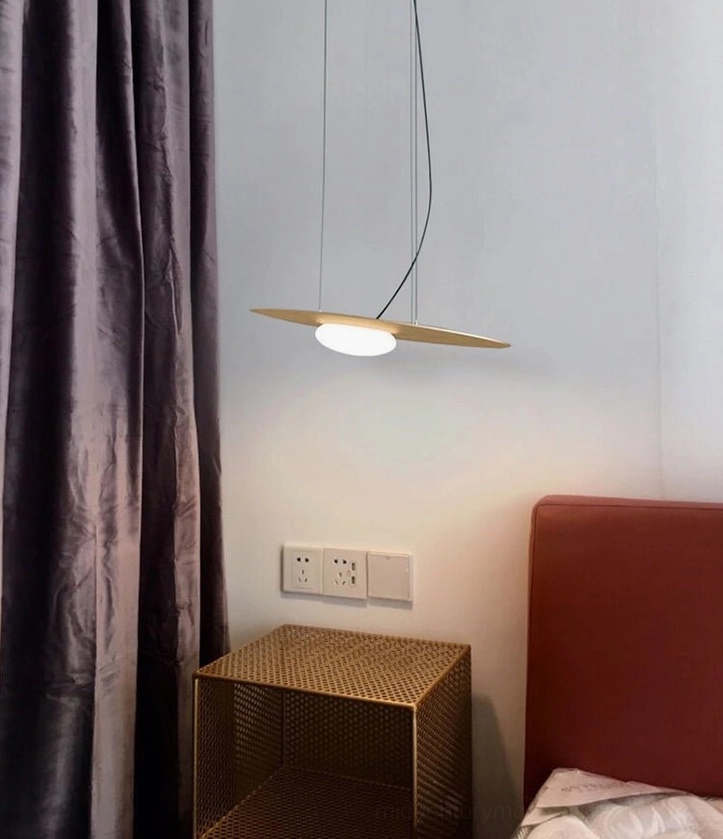 Kwic pendant light fixture showing hemispherical blown glass diffuser and suspension wire assembly