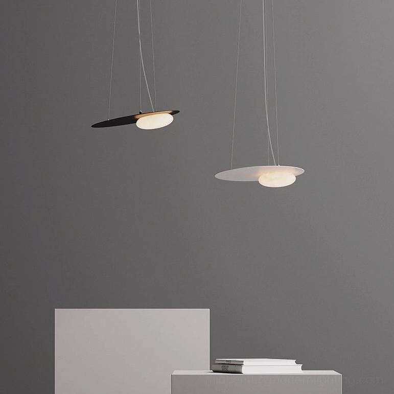 Dual mixed finish Kwic pendant lamps in black and white with warm LED light, minimalist display space