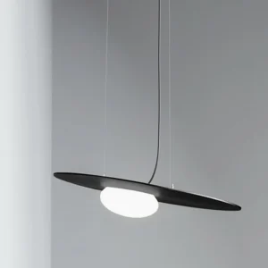 Matte black Kwic pendant lamp shown at eye level with suspension wire against gray background, modern minimalist design
