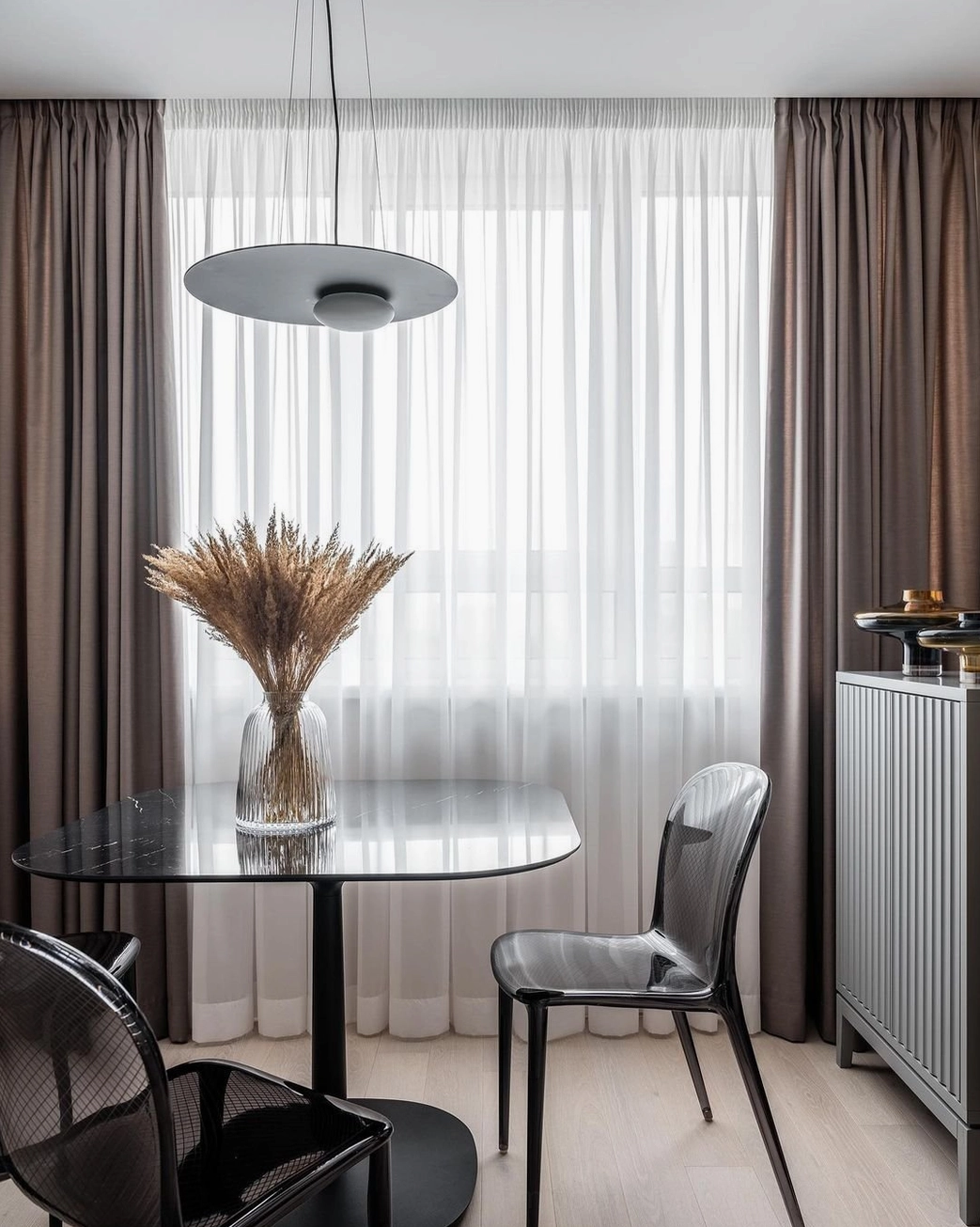 Pure white Kwic pendant lamp with integrated LED at eye level, minimalist Scandinavian design styling